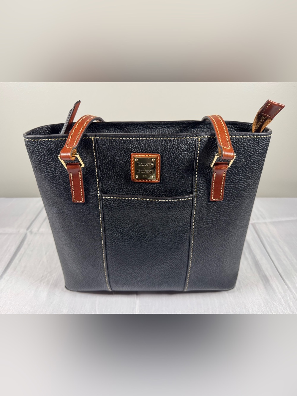 Dooney & Bourke Black Pebbled Leather Tote with Brown Trim and Gold Hardware